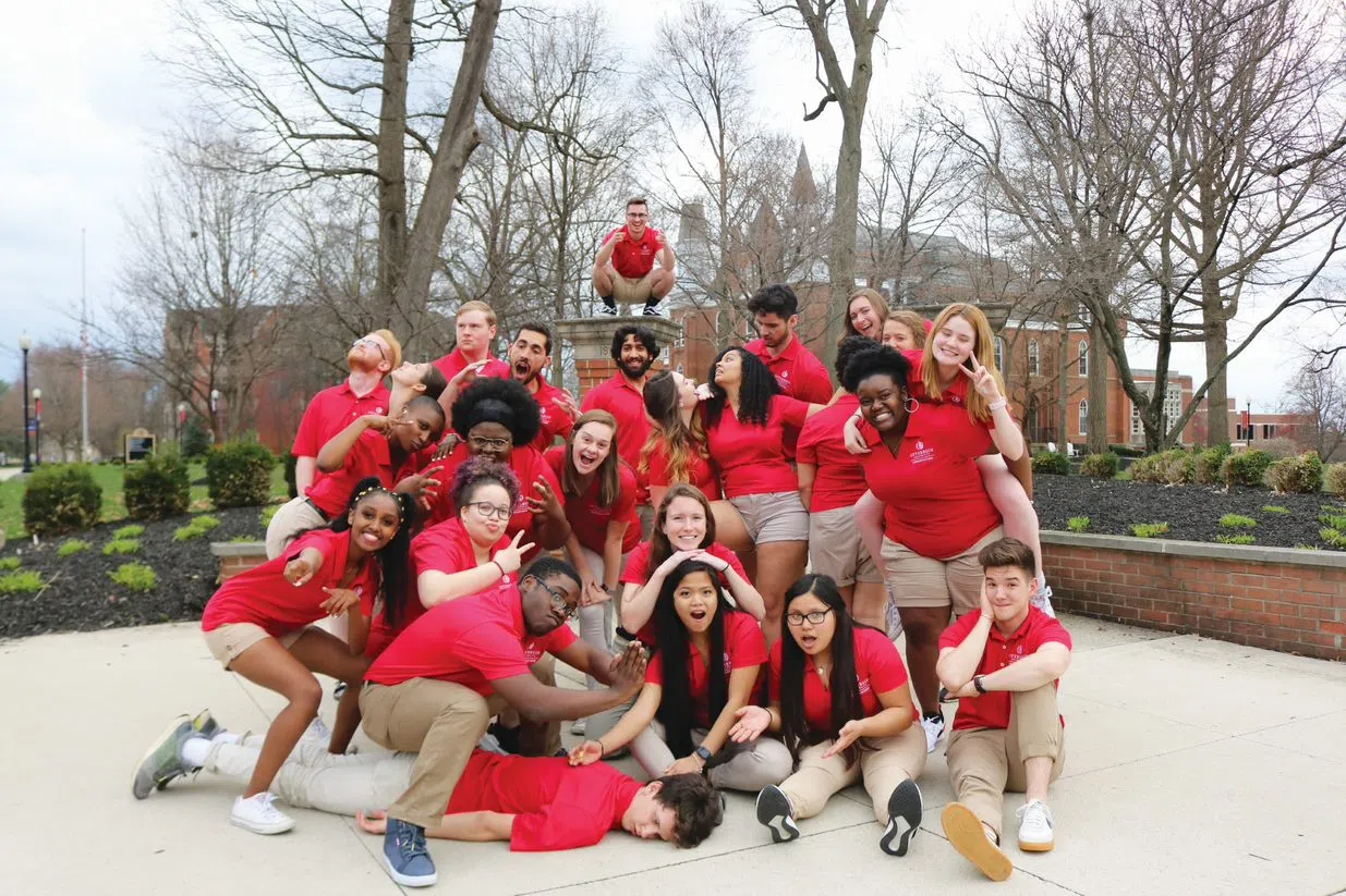 New Student Orientation Leaders pose as a group making silly faces.