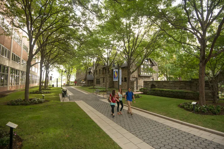 Picture of students walking through campus.