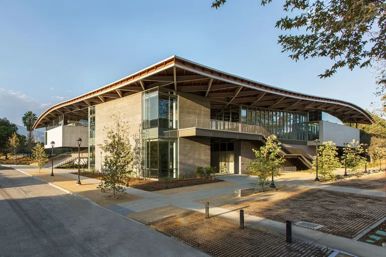 Corner view of modern buildings with trees in forefront