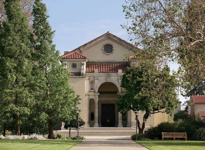 Front of Bridges Hall with tress at forefront