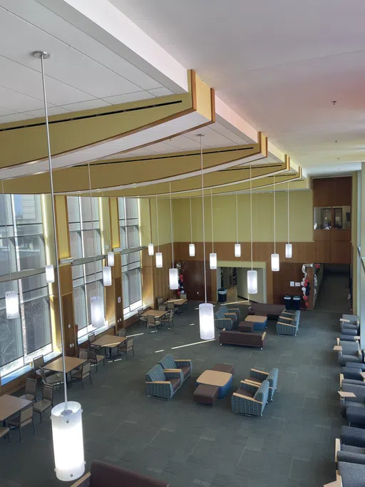 Image shows a lounge in the Law School from an above angle. 