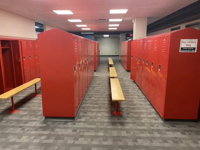 The locker room is decorated in Rutgers red.