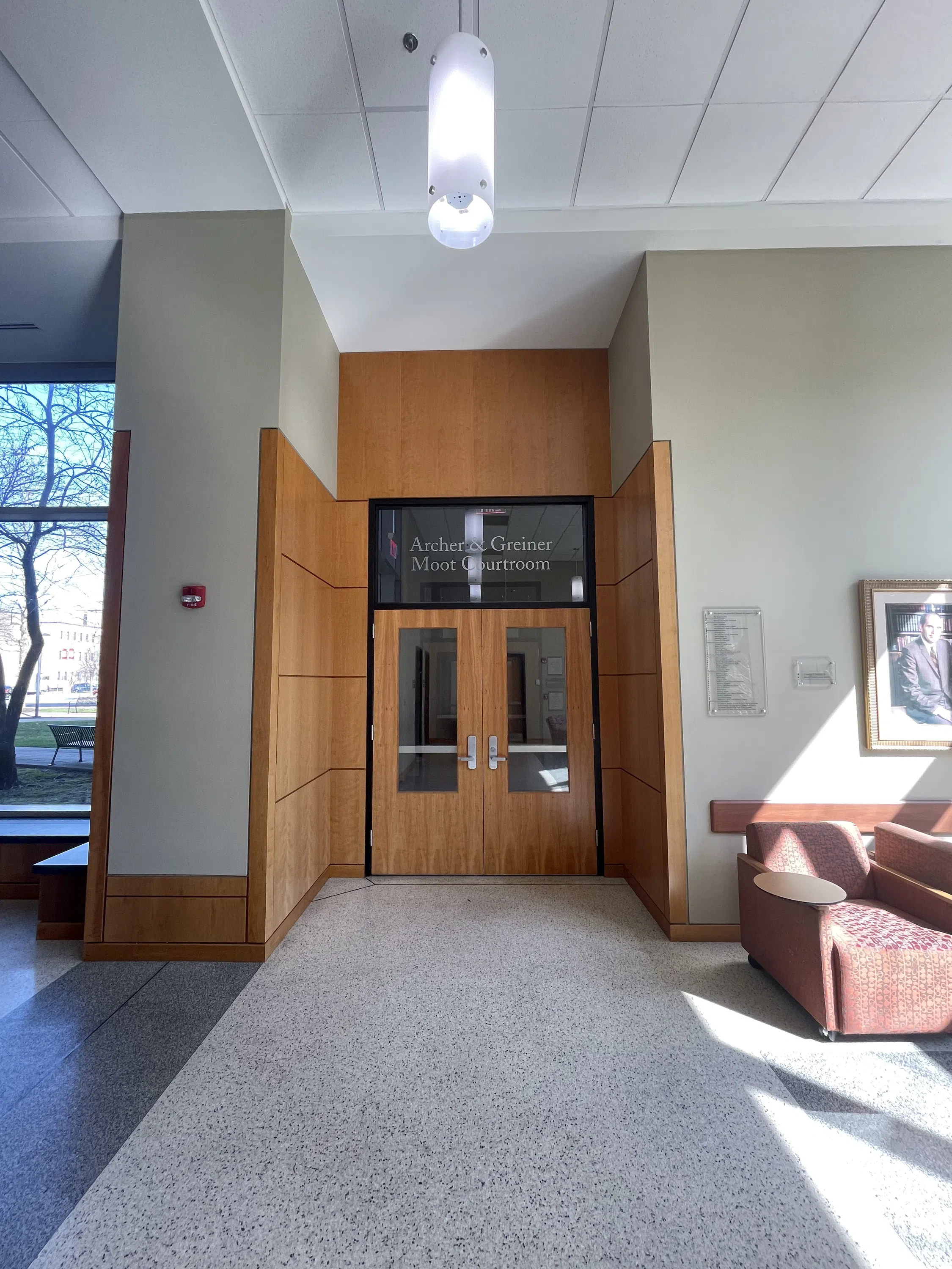 The photo shows the entrance doors to the mock courtroom