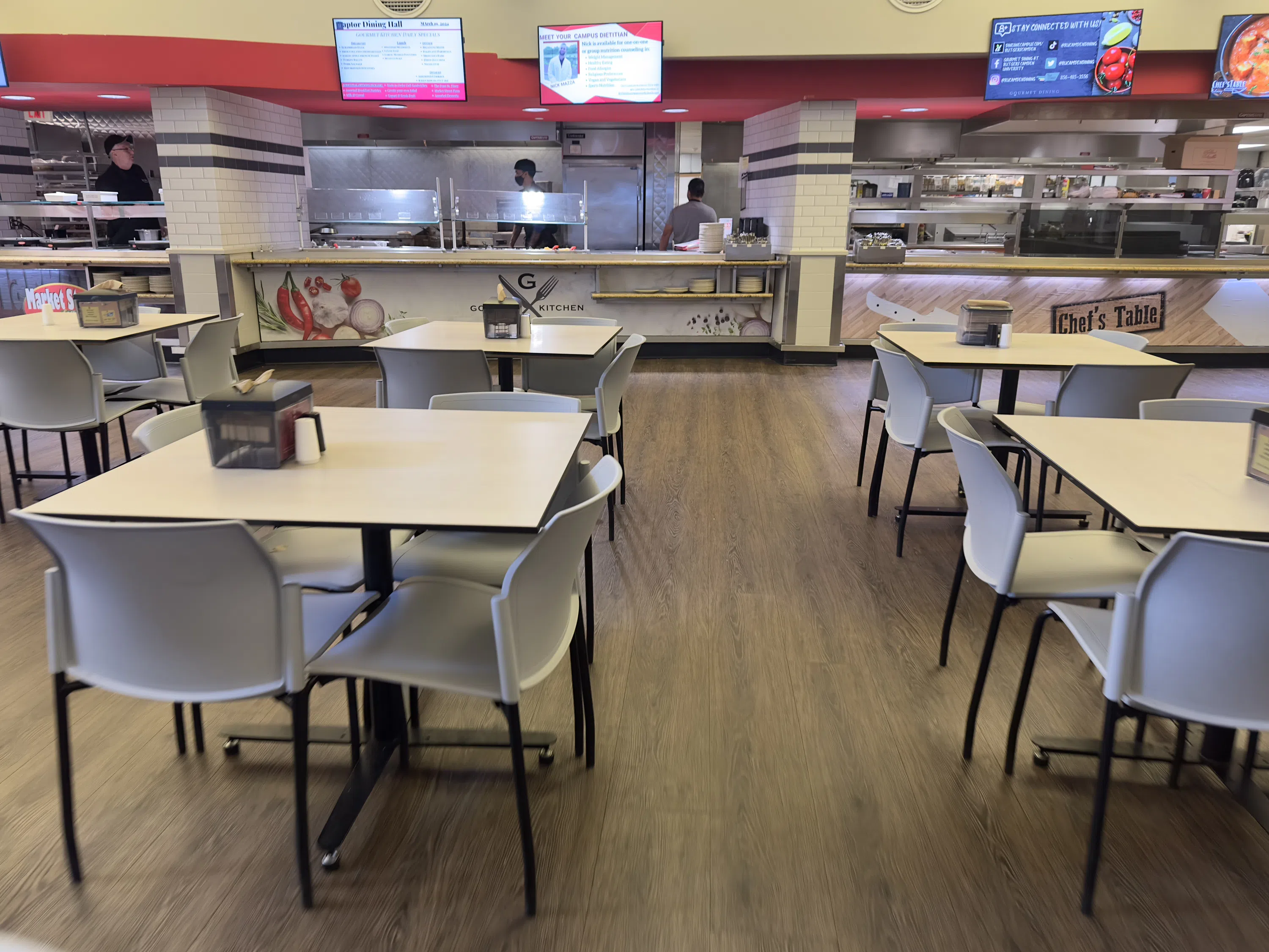 Chefs prepare food for students.