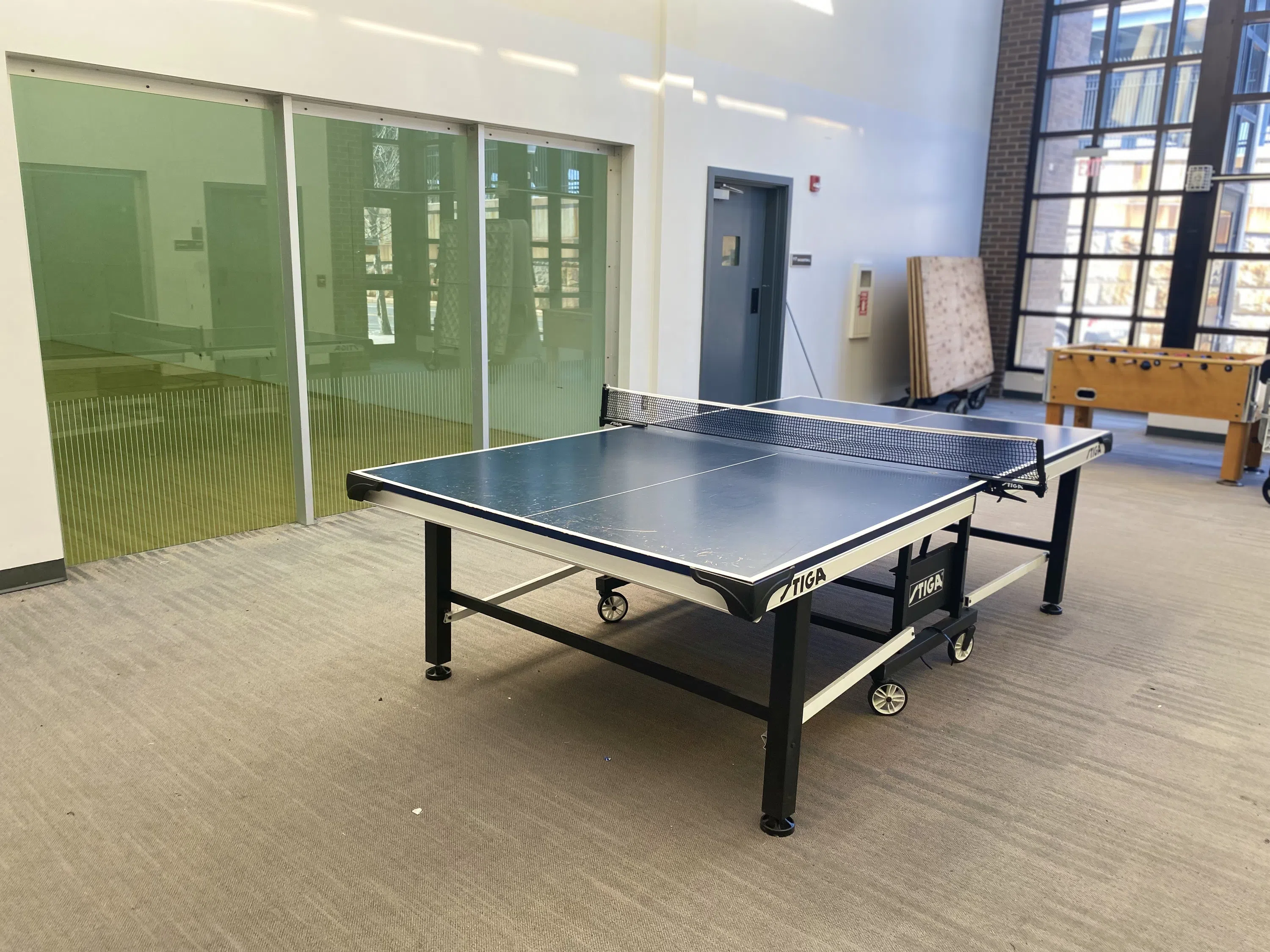 A ping pong table is located in the Fitness Center.