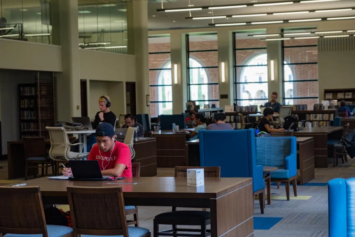 Students studying at Rice University's Fondren Library.