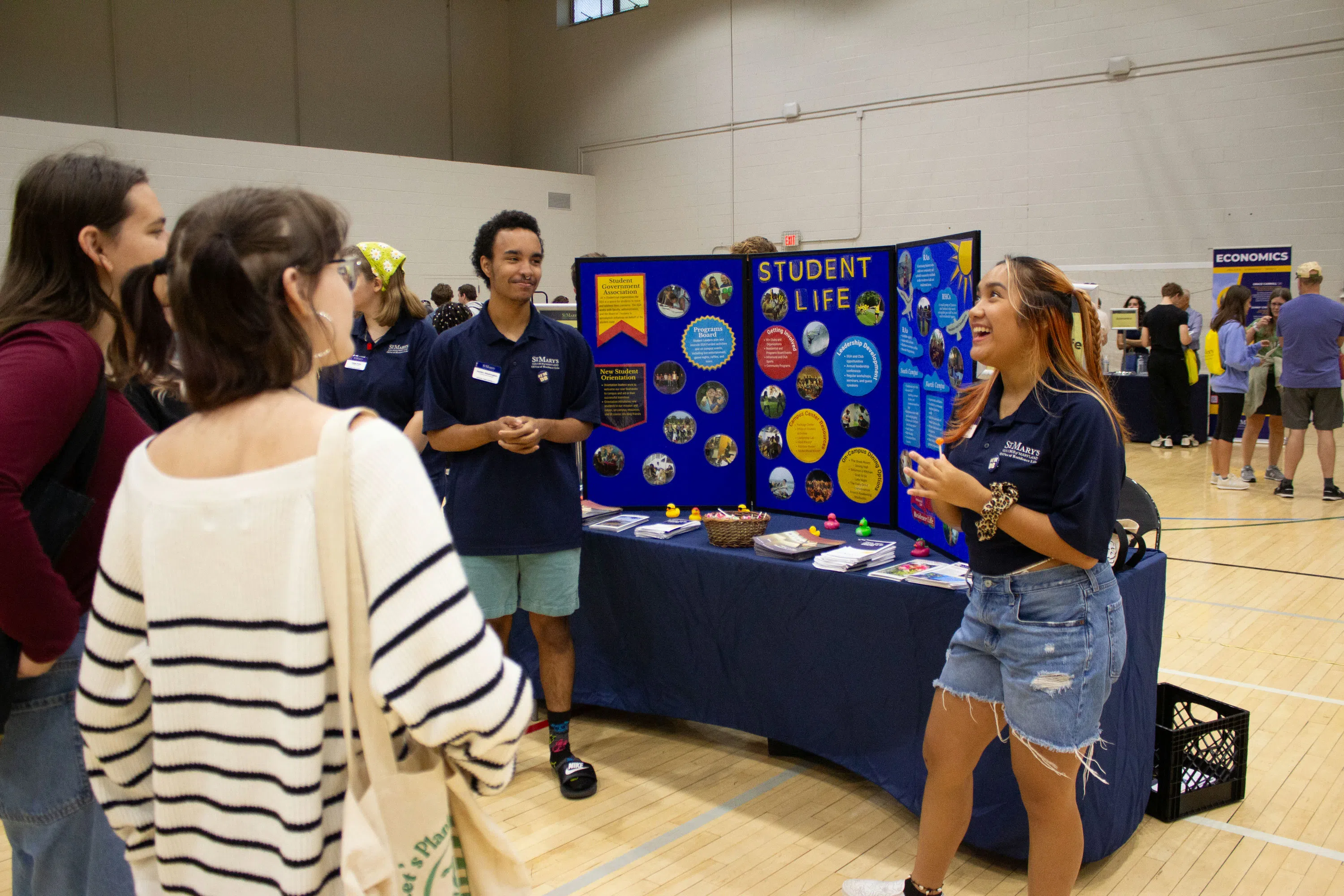 Current students talk about student life at the Open House's Academic and Student Resource Fair