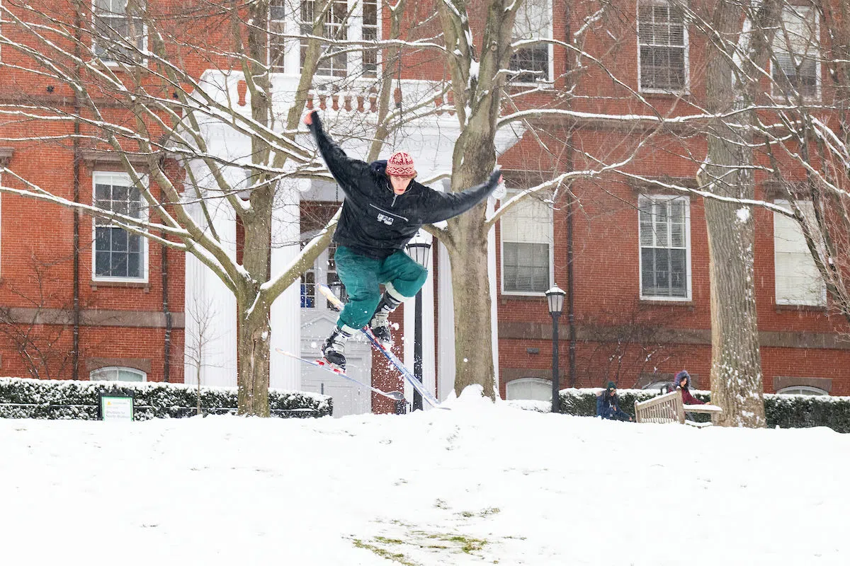 The President's Lawn: a student skis down the hill