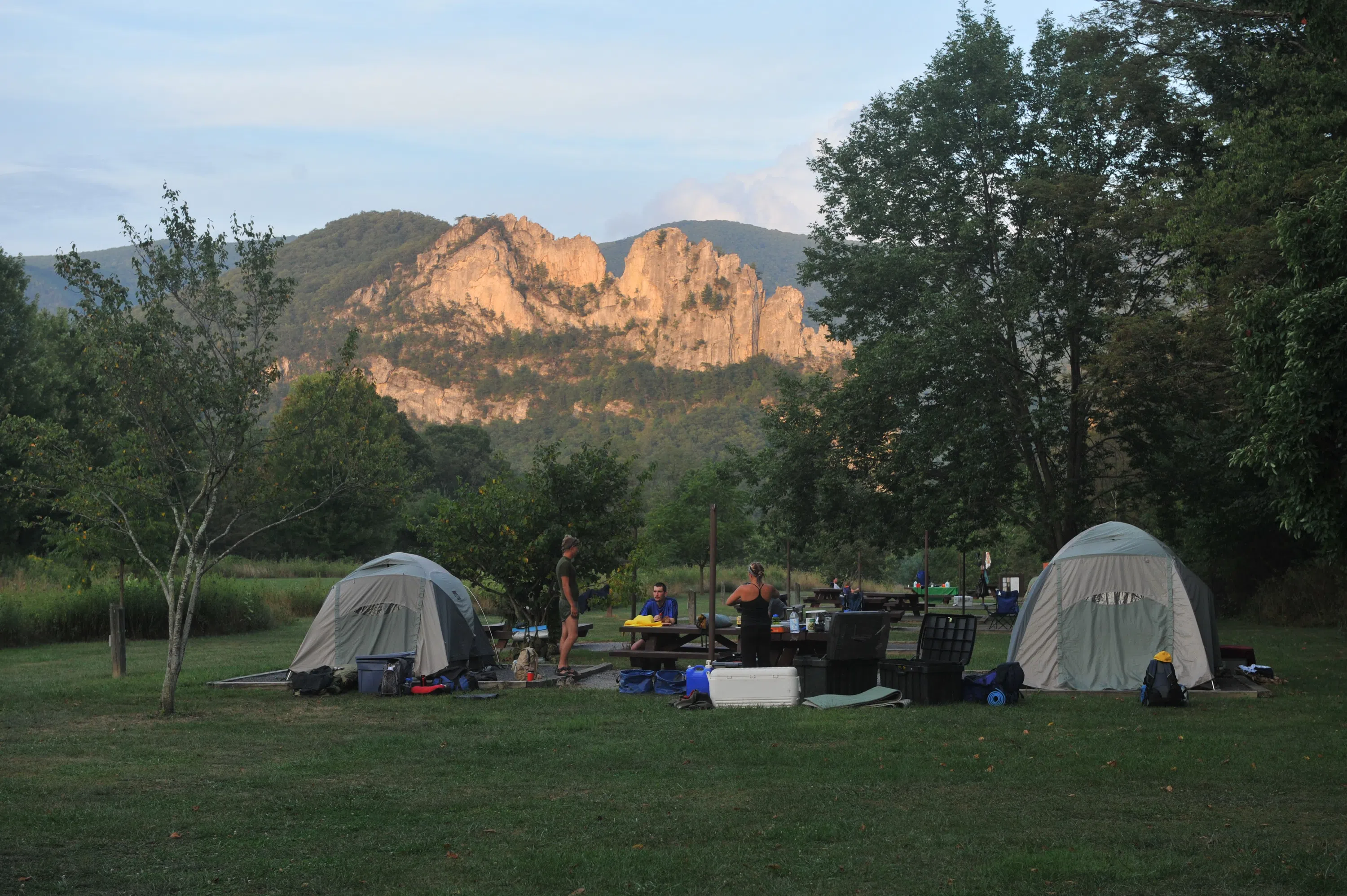 A group of tents pitched under Seneca Rocks 