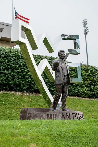 Silver flying WV statue situated in front of the stadium.