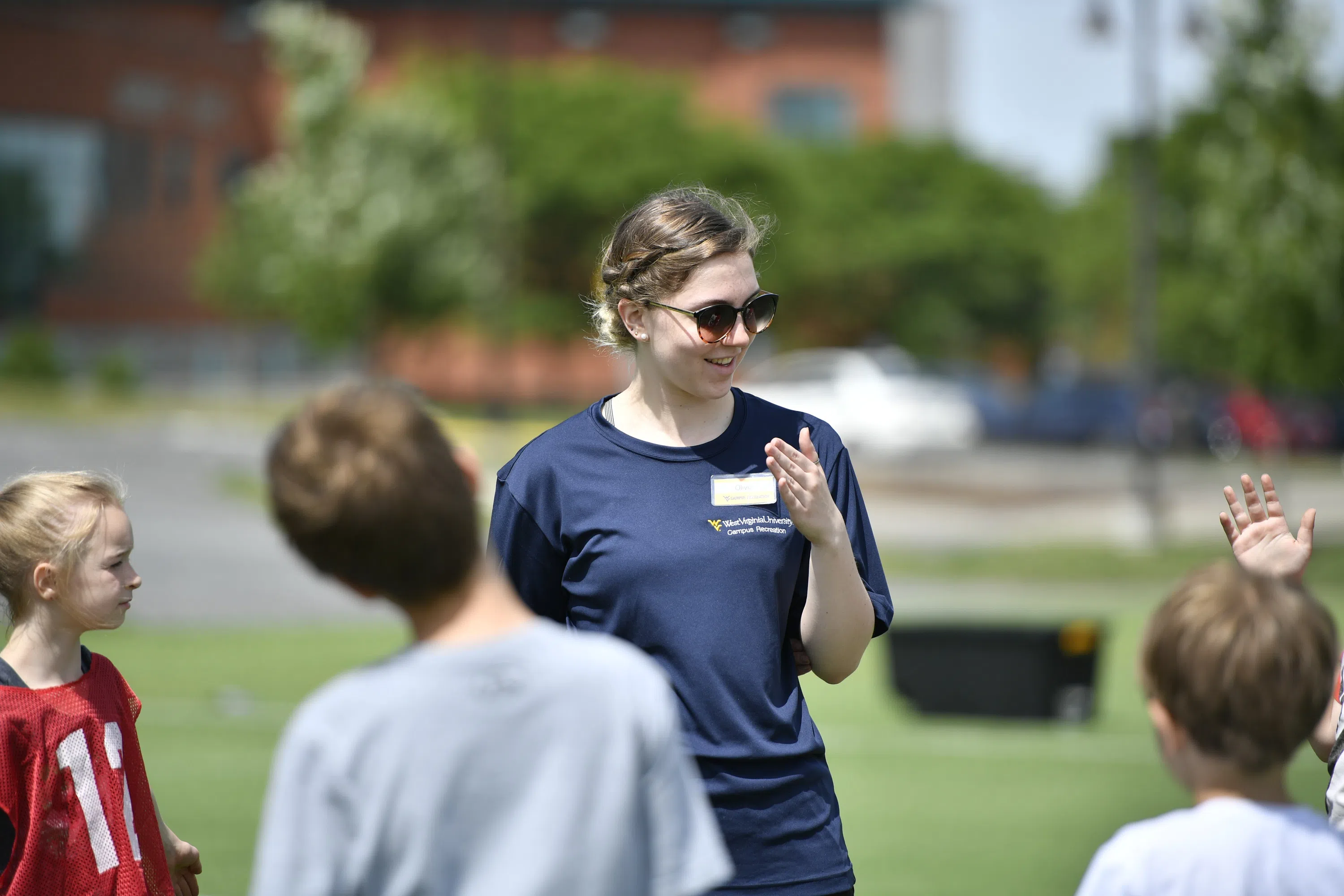 CPASS Student leading a coaching class with children. 