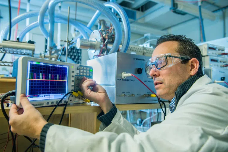 A faculty member inside a Clark Hall Lab space.