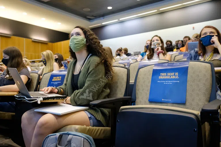 Inside one of Ming Hsieh Hall's lecture halls, students listen attentively to their instructor.