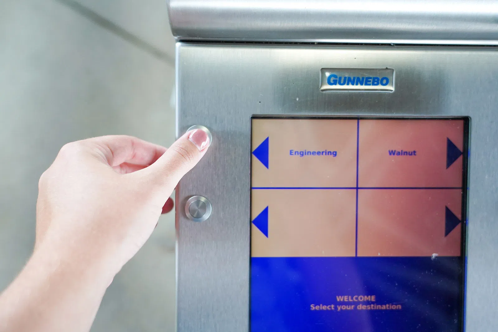Image shows a student selecting their desired PRT station destination on the automated screen. 
