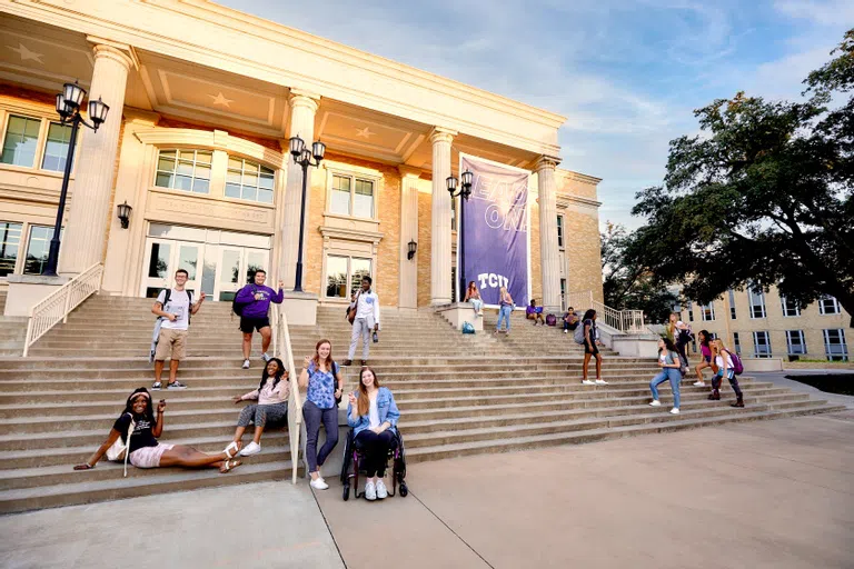 Students on the front steps of the library