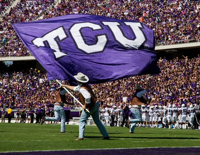 The TCU flag is waved to a sold-out crowd right after a touchdown