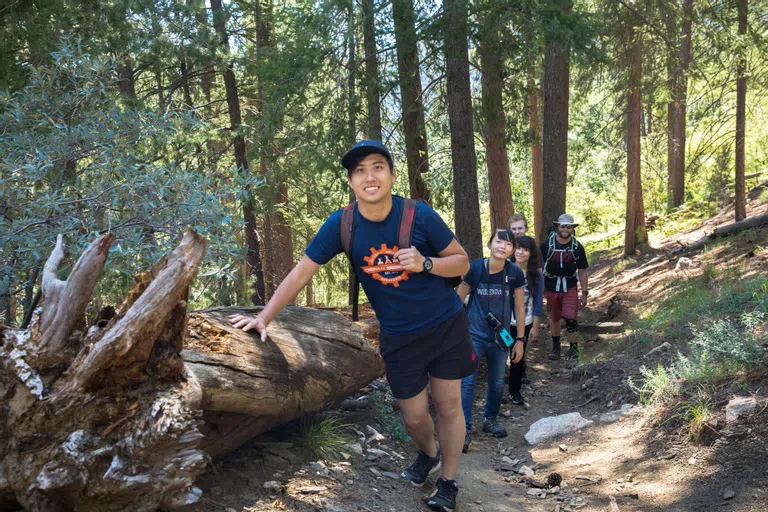 Asian student hiking in the forest