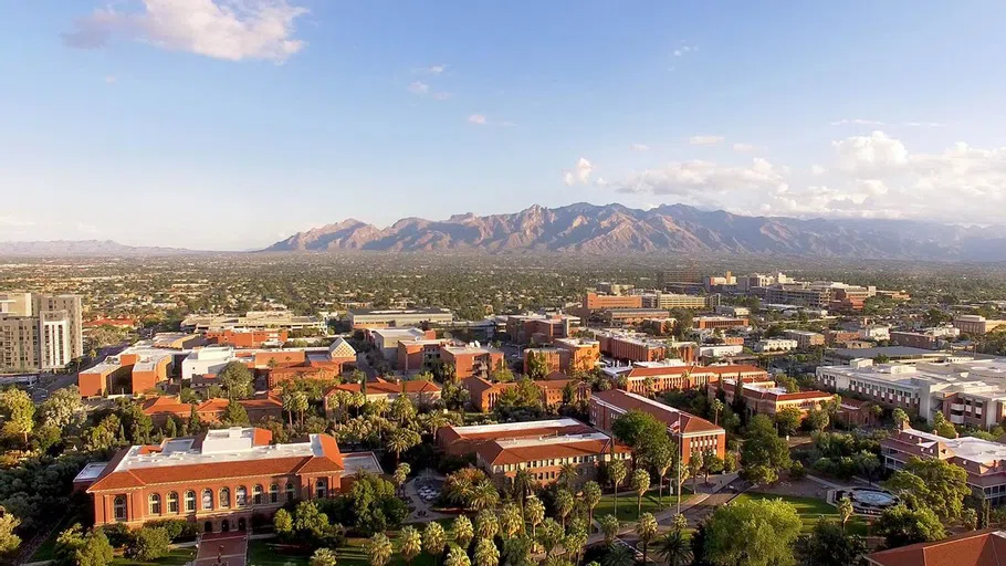 University of Arizona campus shot with mountains in the background