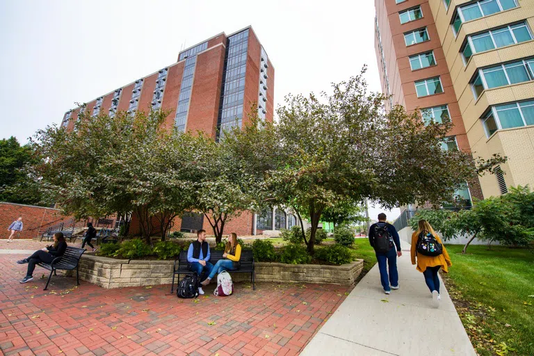 Students outside residence halls on the west side of campus