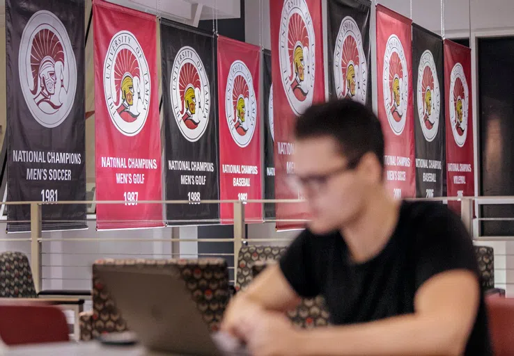 Student studying in the Spartan Club located in the Vaughn Center.