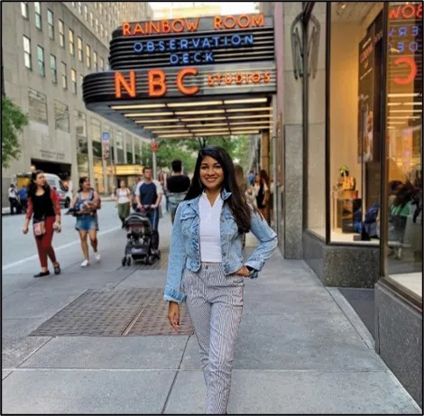 Student standing in front of NBC in New York City