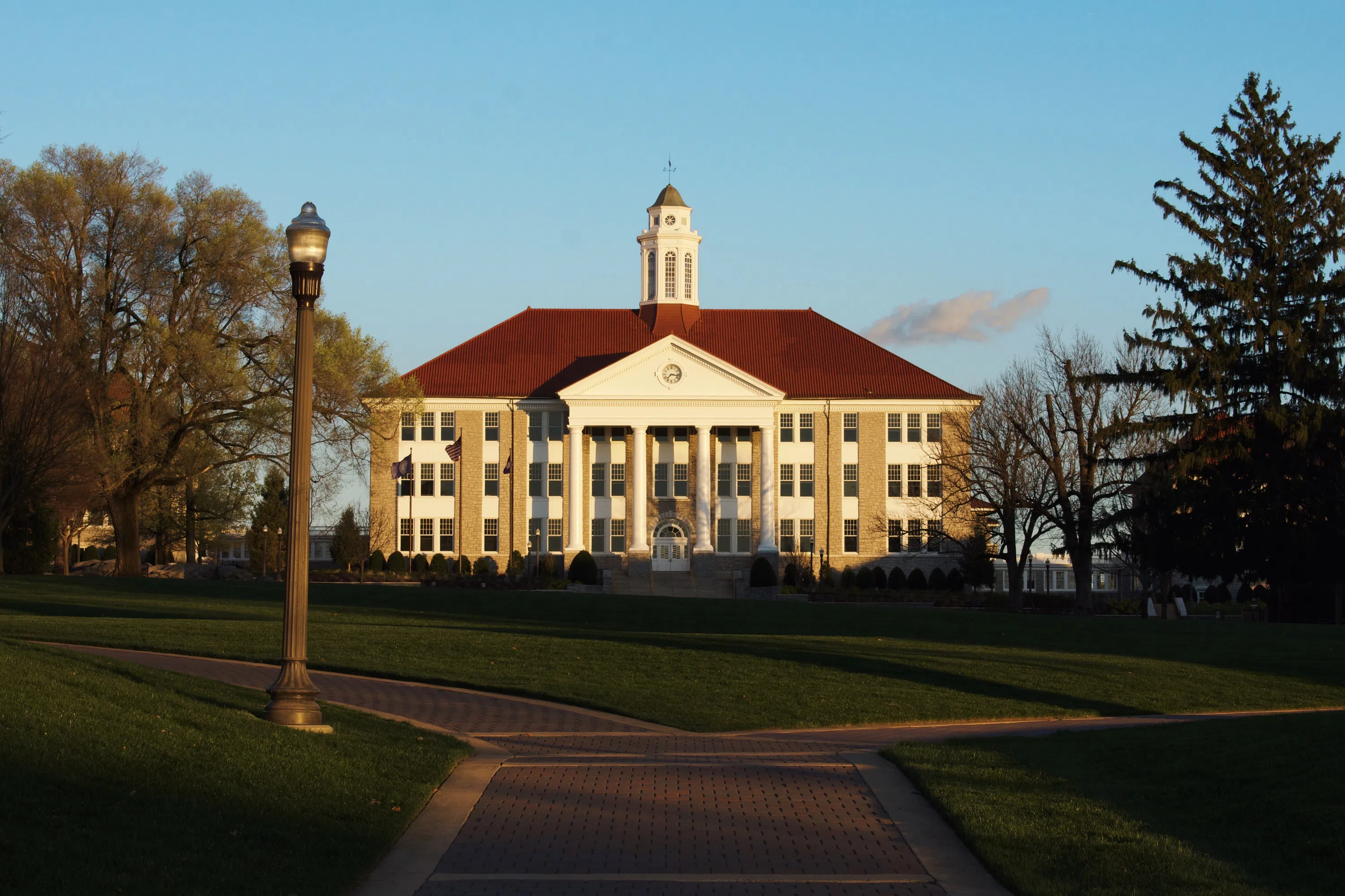 The Seton Residences building with 3 pillars, walkways and green area in front