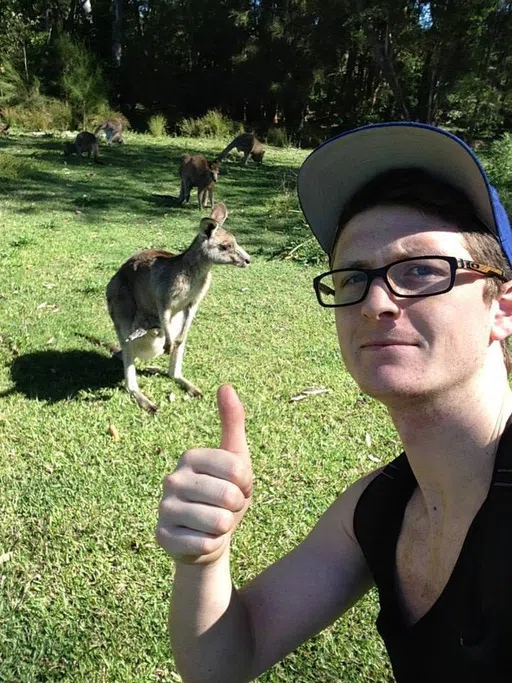 Student taking a selfie with a kangaroo