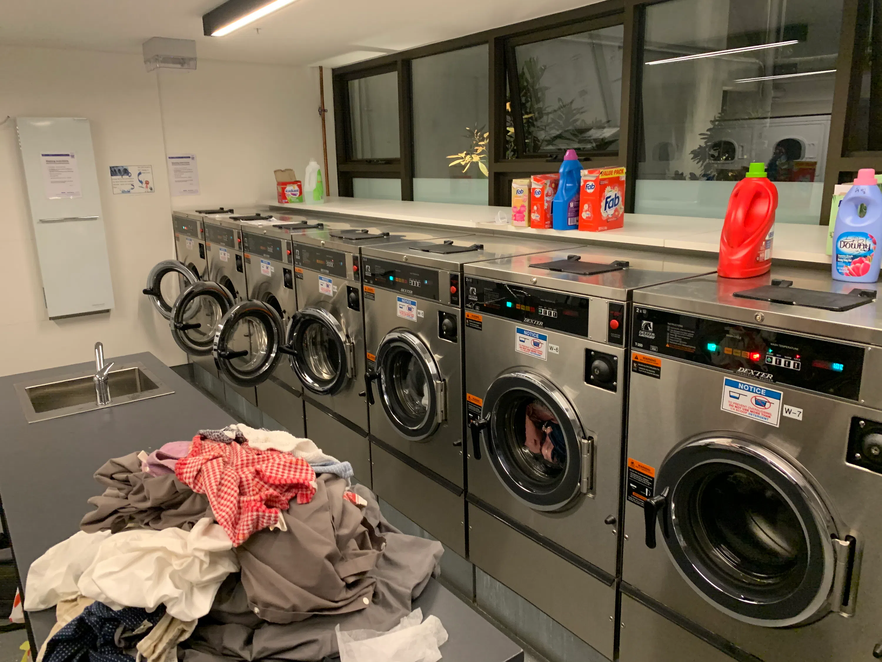 Dryers all set up in the laundry room 