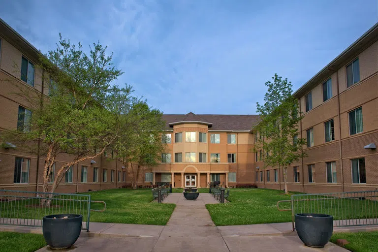  A photo of the exterior of Traditions Hall and the surrounding courtyard