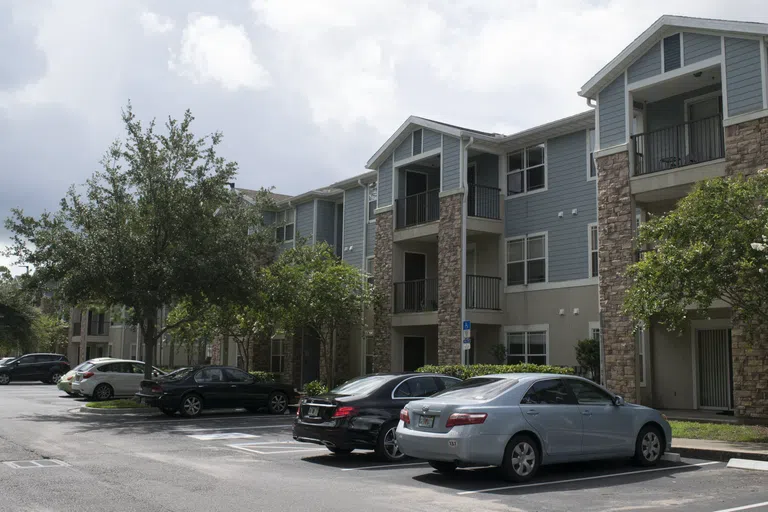 Cars parked outside of The Flats at UNF