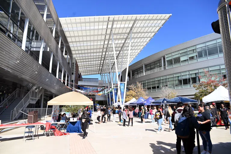 Students walking around tents set up in Student Union Plaza for Market Days