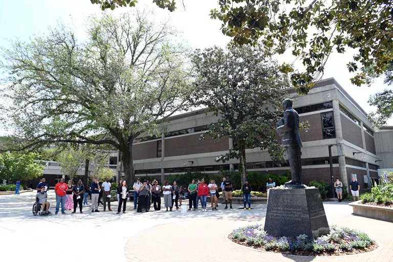 Tour group gathered in front of Dr. Martin Luther King Jr. Monument in Peace Plaza