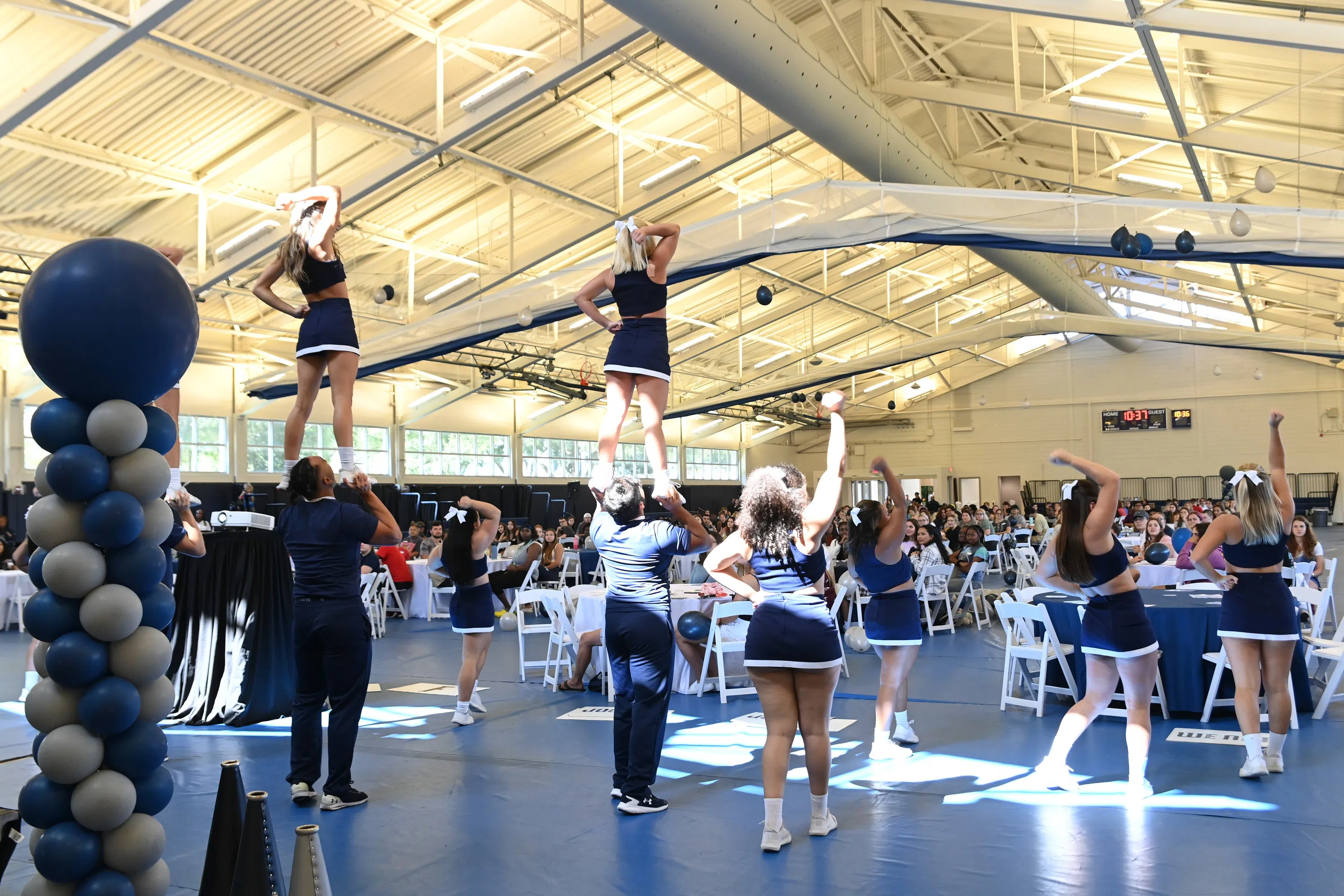 UNF Cheer Team performing at event in the Field House