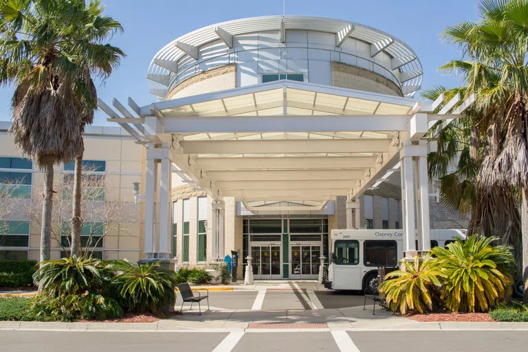 Front exterior of Hicks Hall and an Osprey Connector 