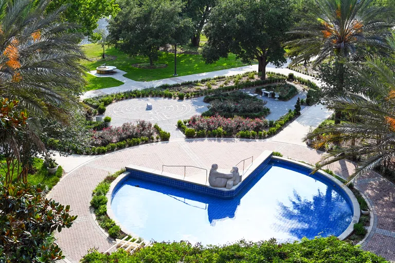 Birds-eye view of the Brooks College of Health reflection pond and gardens