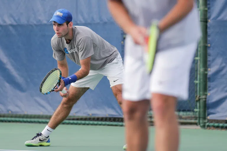 Men playing tennis