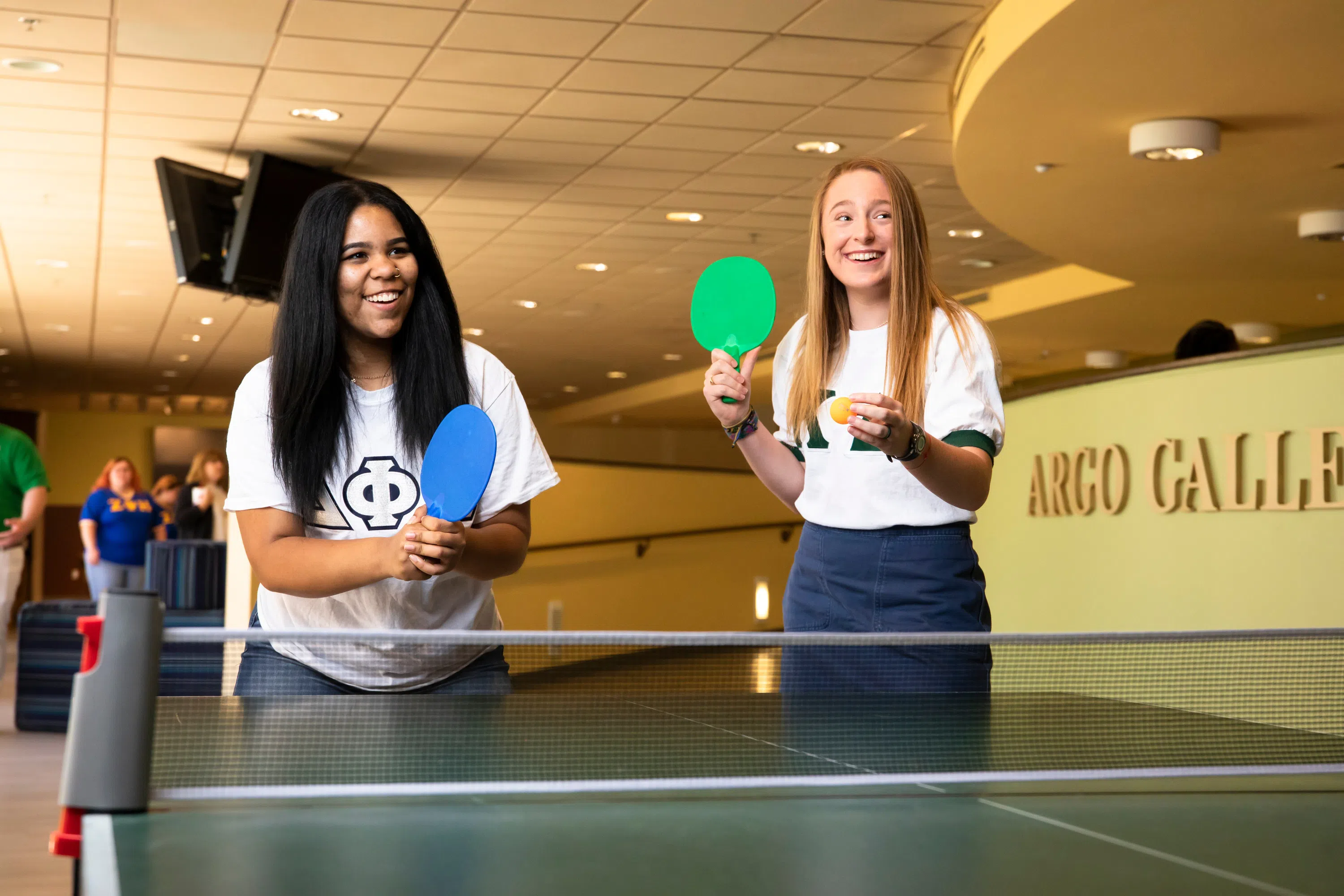 Two sorority students playing ping pong