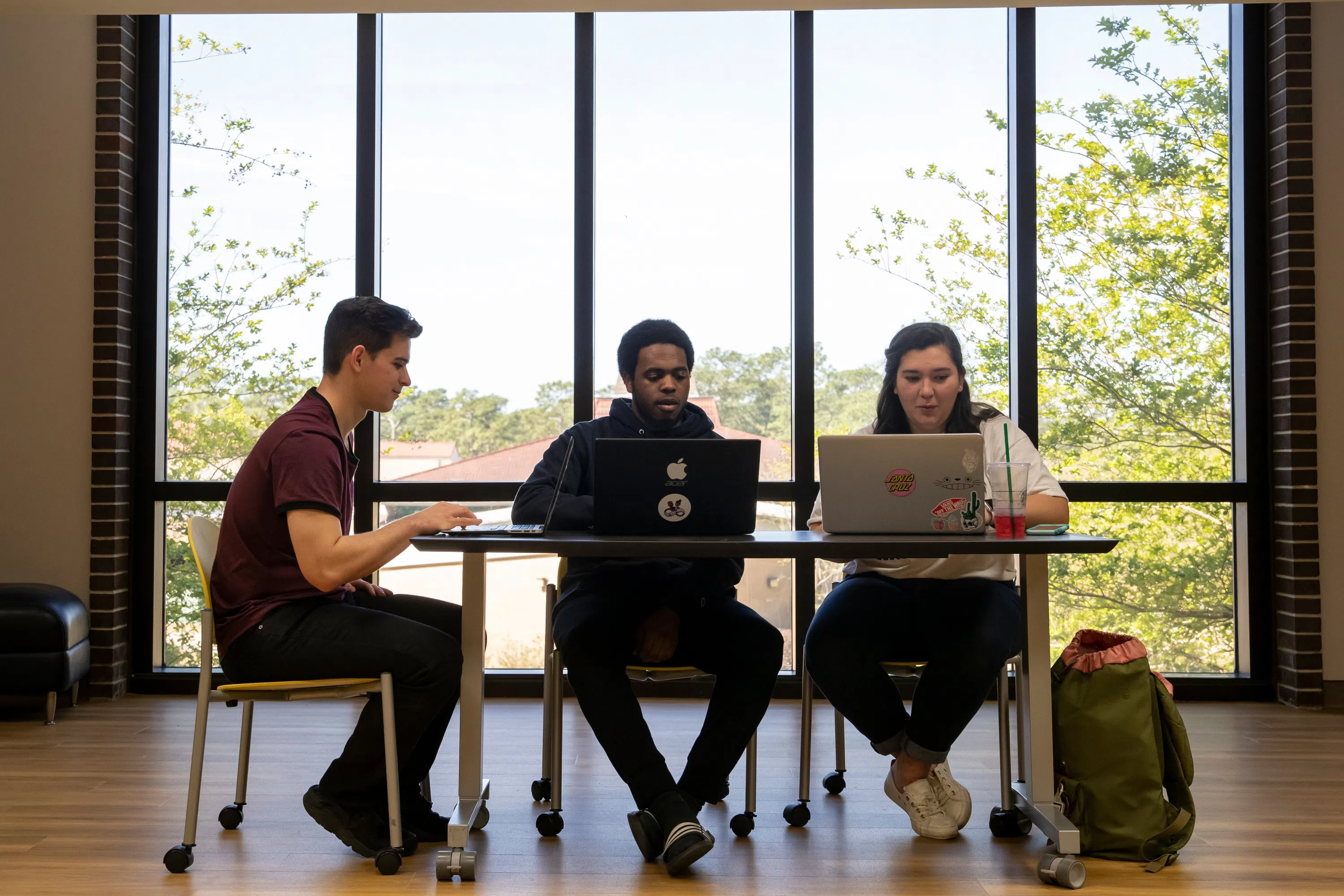 UWF students studying on the second floor of the John C. Pace Library