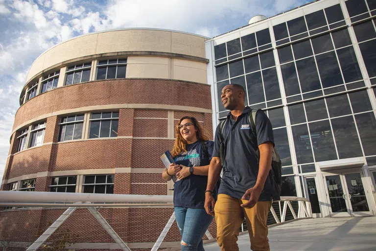 Students exiting the Hal Marcus College of Science and Engineering.