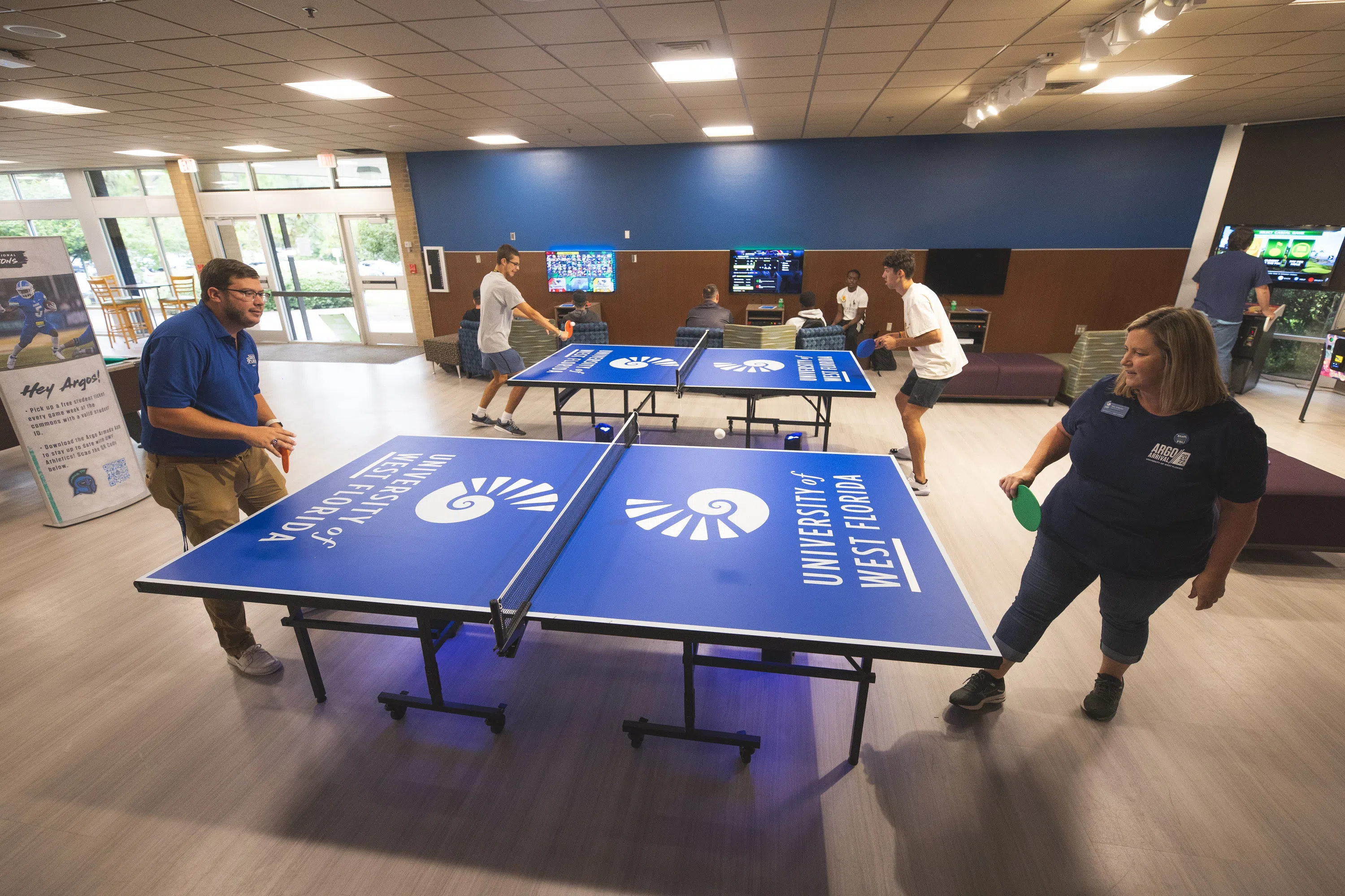 People playing ping pong in the Argo Galley Game Room