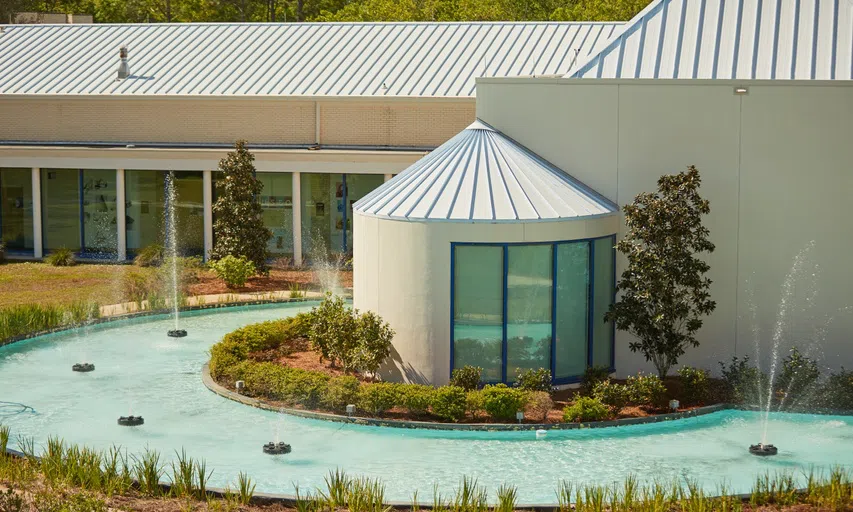 The exterior of the Center for Performing Arts with fountain.