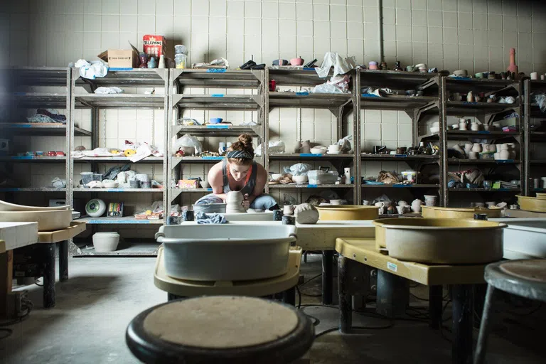 Student working on a ceramics art piece in the ceramics studio