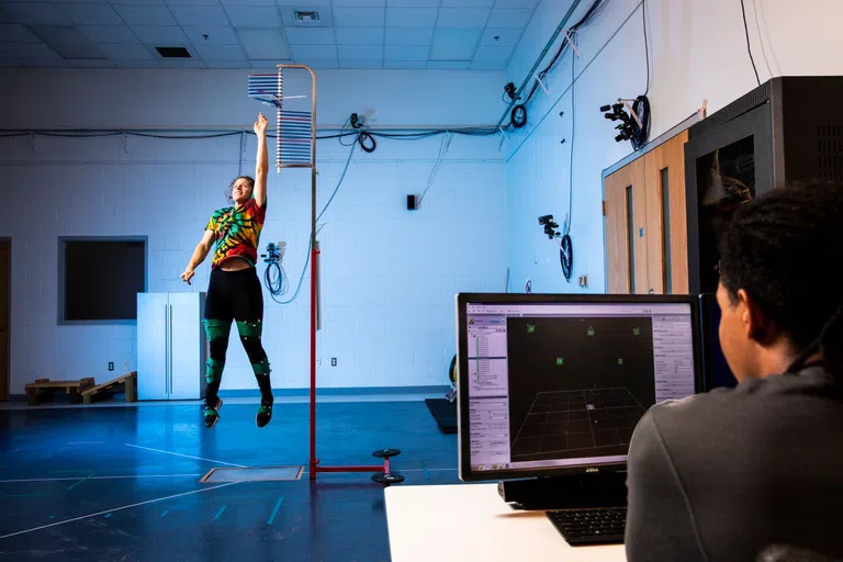 UWF exercise science student running through various fitness routines in the biomechanics lab.