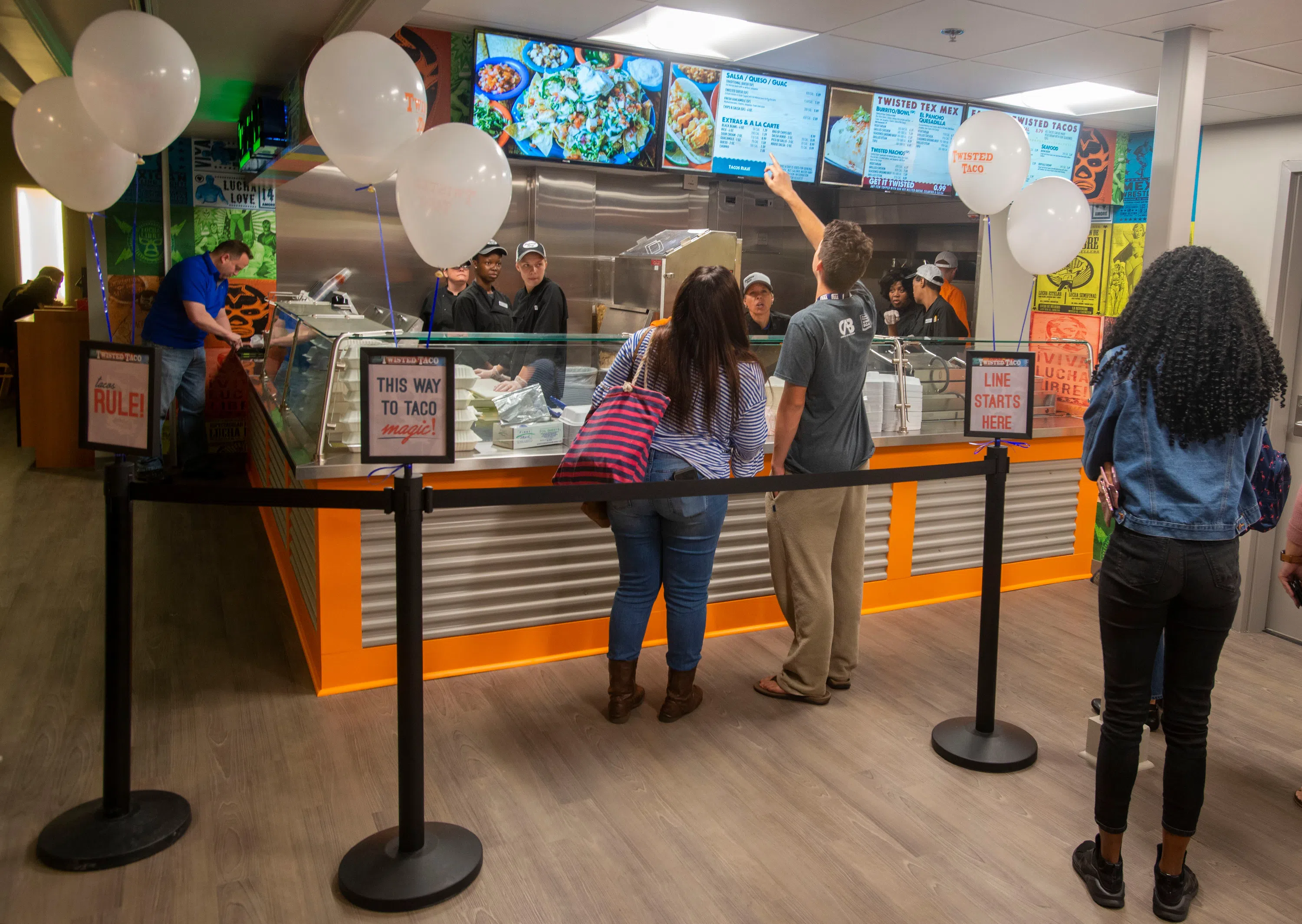 Students in line at the counter of Twisted Taco, an American Mexican Cantina fusing new American and bold Mexican flavors to form a one of a kind “Twist” on Mexican cuisine. 