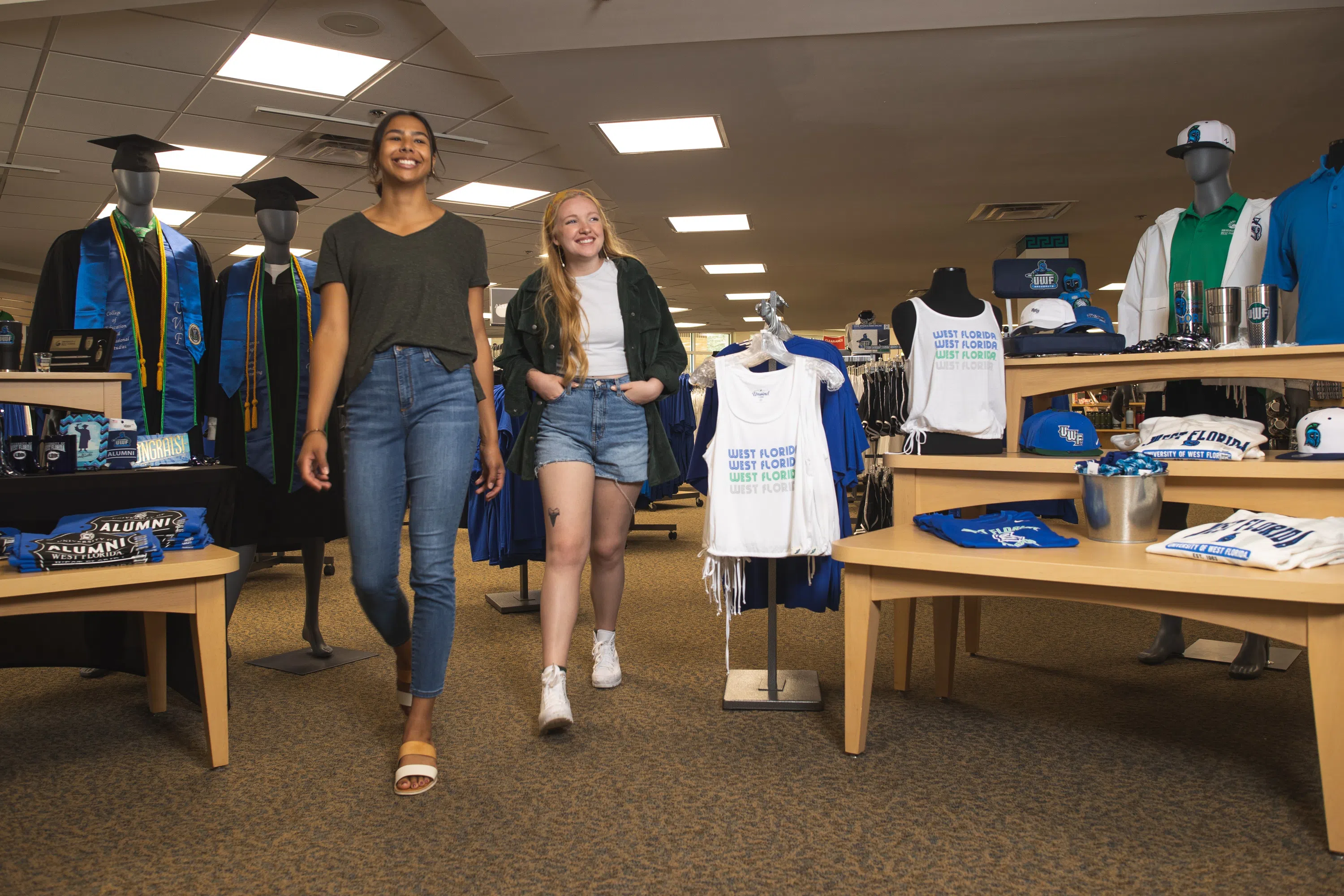 Two students shopping at the UWF Bookstore