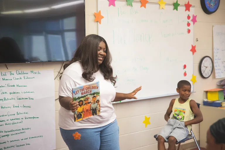 Teacher reading to children