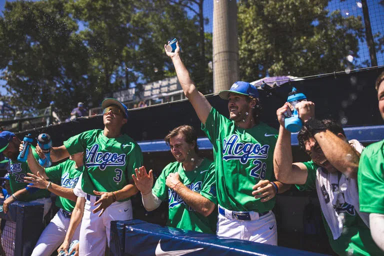 Men's baseball cheering from the dugout