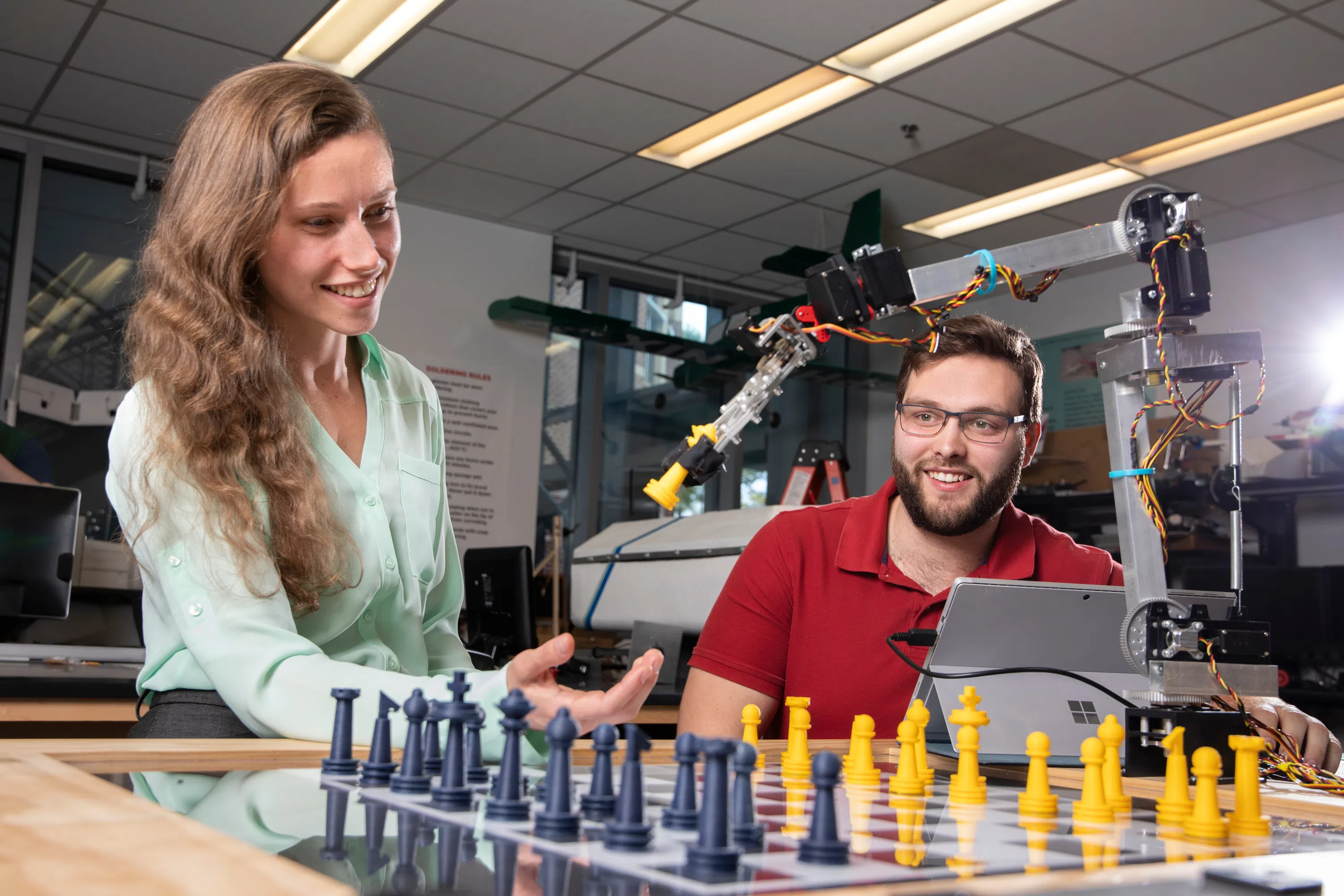 UWF engineering students work on a mechatronics project in the Science and Engineering Building.