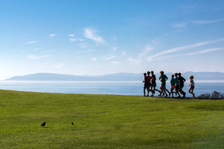 Students running on East Field