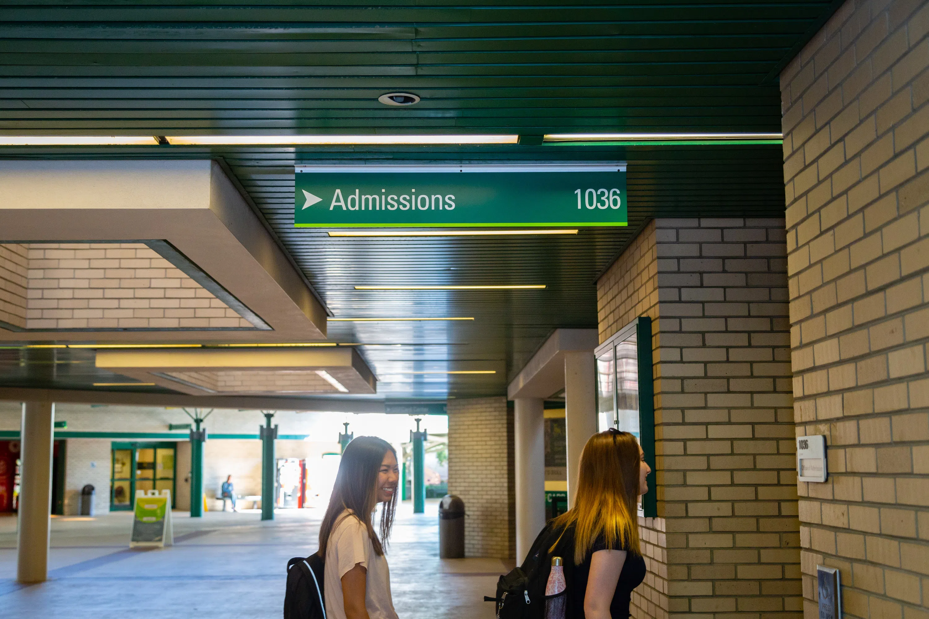 1st floor of SVC, Admissions entrance, Green Admissions sign: 1036